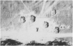 Dugouts behind the frontline, rear fortification, on the German Luftwaffe Aerial Reconnaissance photogtaph, scale ~1:8000. Camouflaged by the camouflage net or by the grass